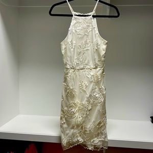 Brand is Mystic from LA, cute off white lace overlay with a sexy hemline